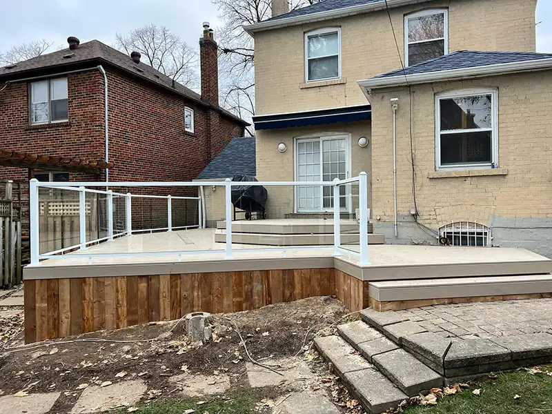 Stunning all season PVC deck with funky cool angles and beautiful glass railings1